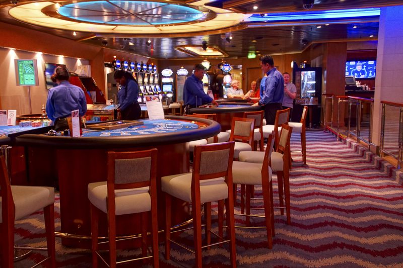 Card tables and slot machines in a cruise ship casino