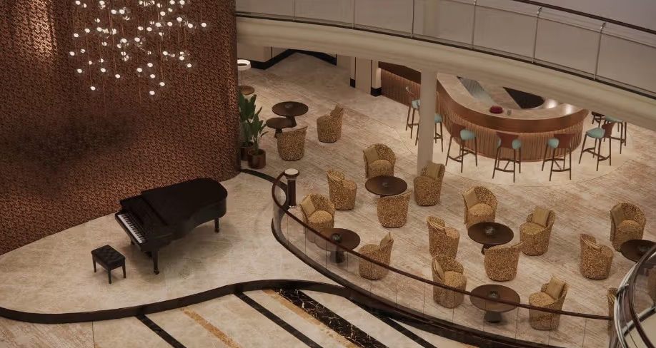 Ship lounge with small tables, wicker chairs and a grand piano seen from above
